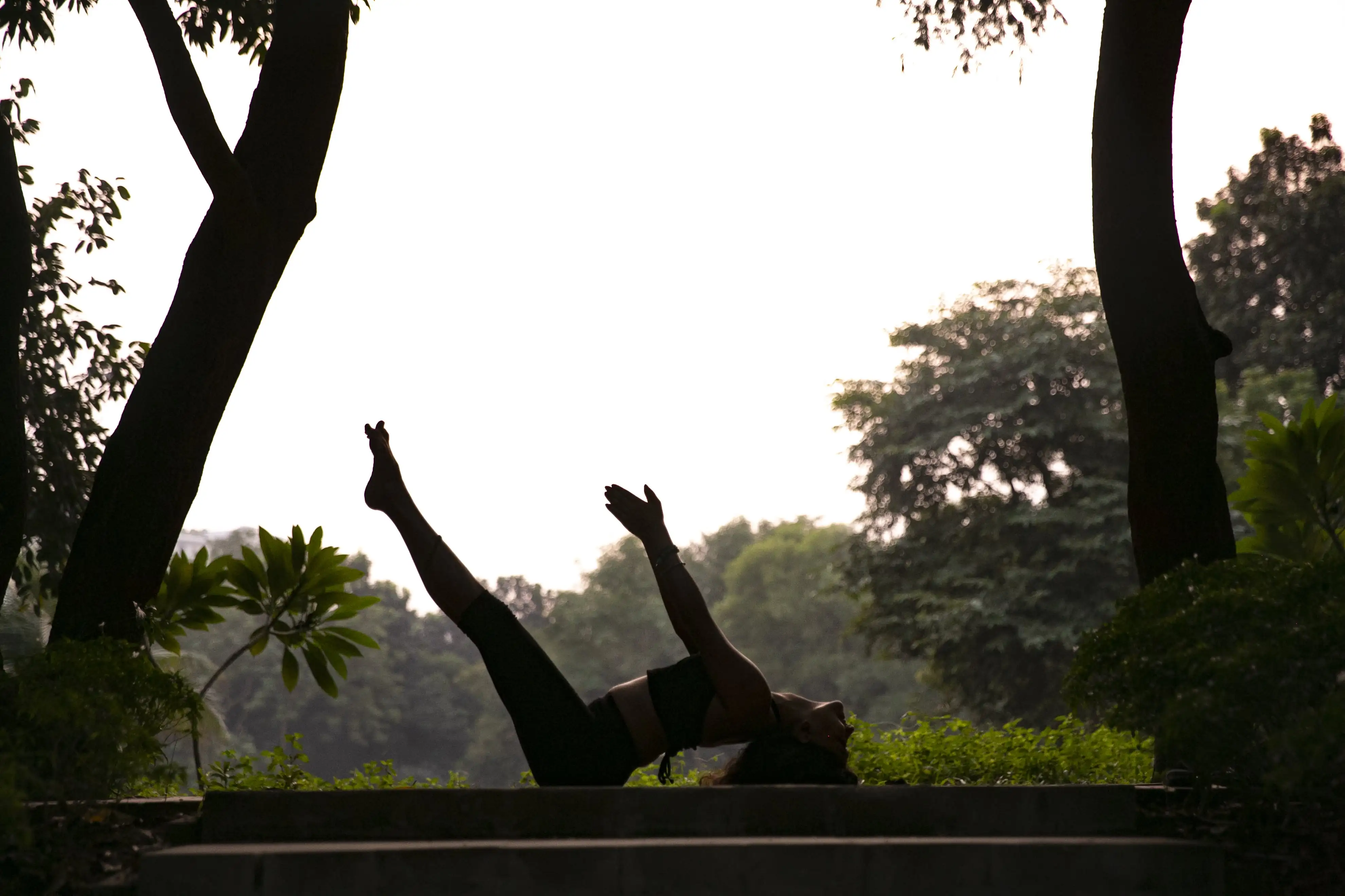 Serene yoga session at sunrise with mountain backdrop