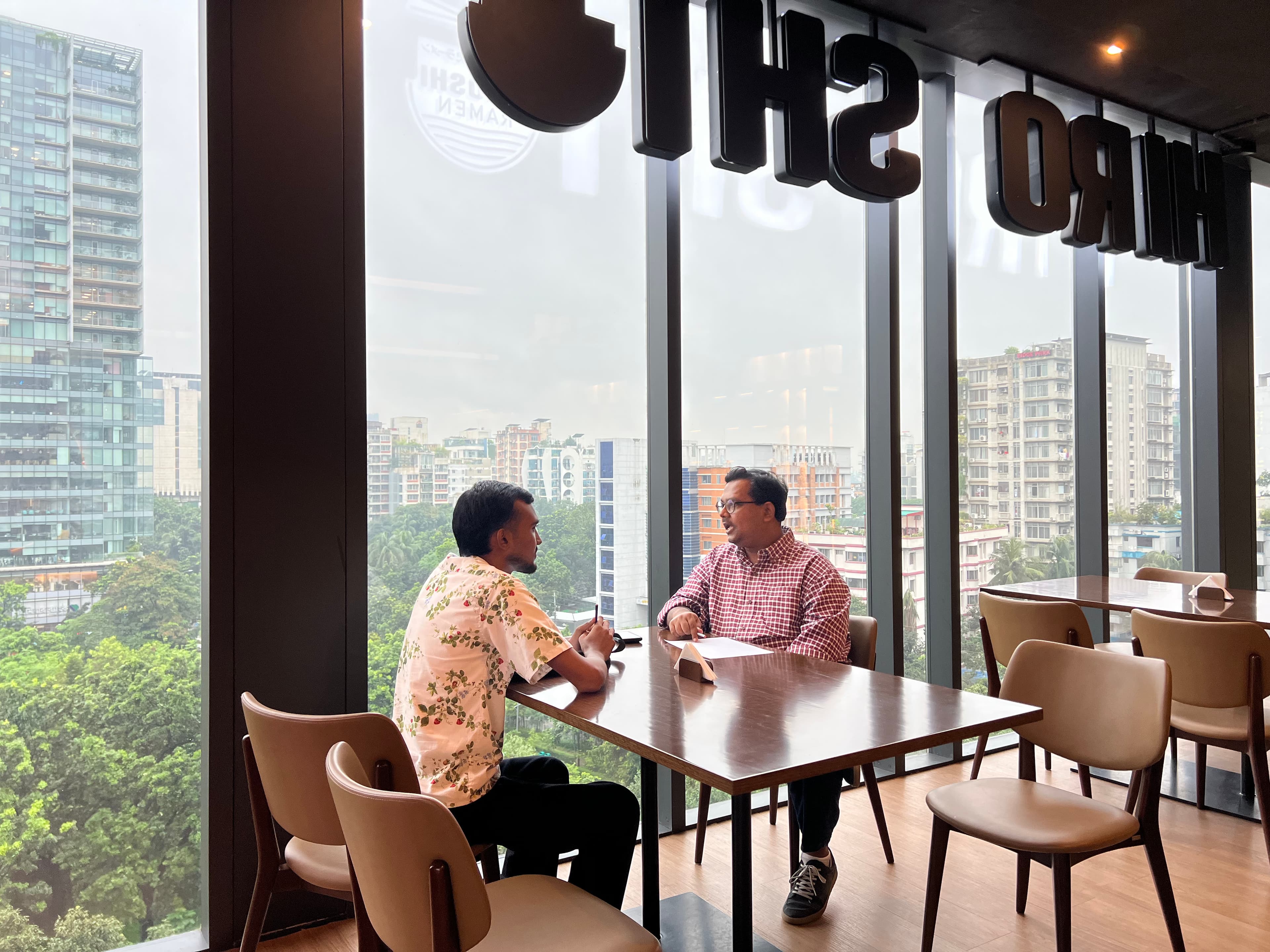 One-on-one conversation with Dhaka skyline